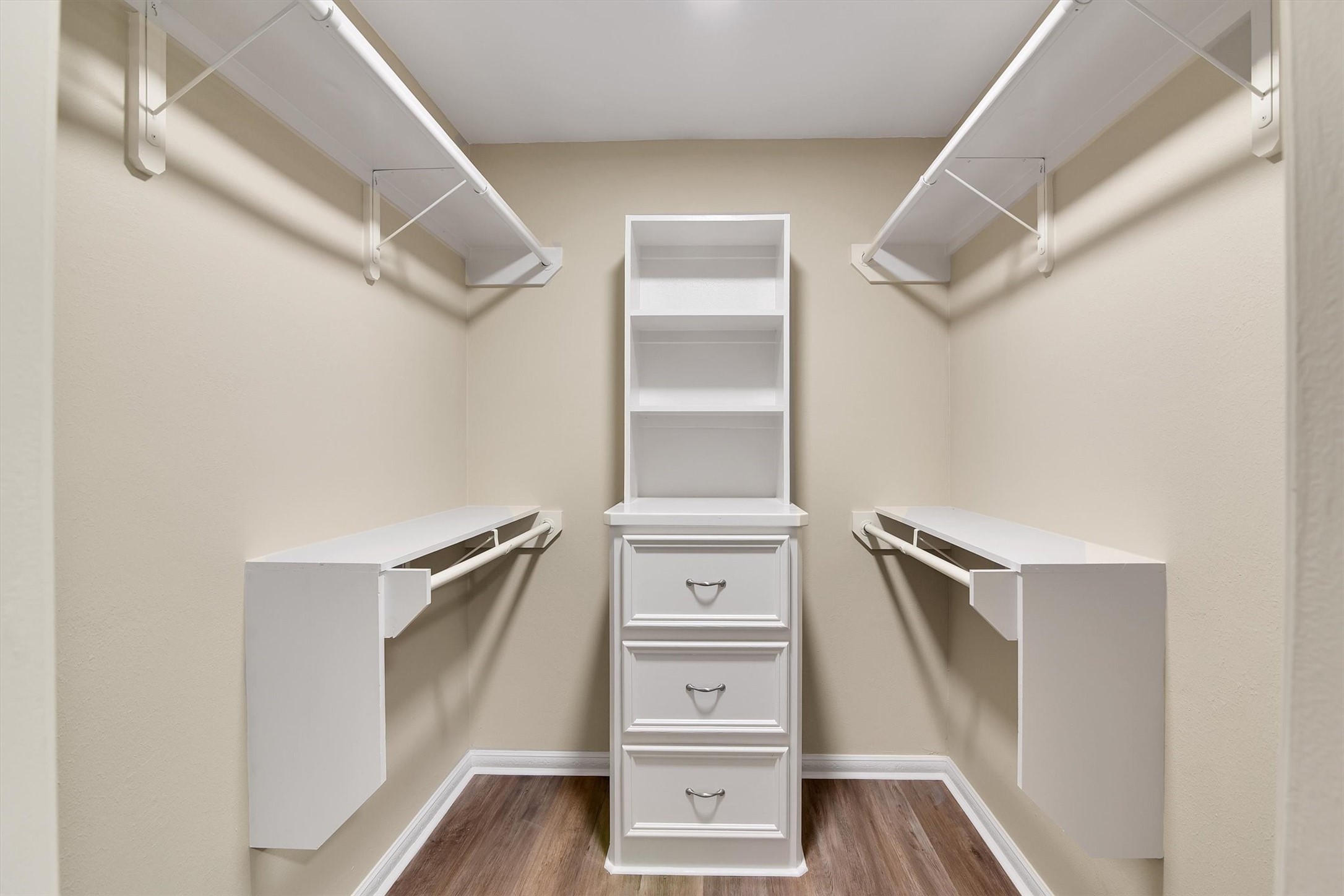 345 Maple Lane Conroe, TX 77304 - Photo 17 of 35 a view of walk in closet with empty racks