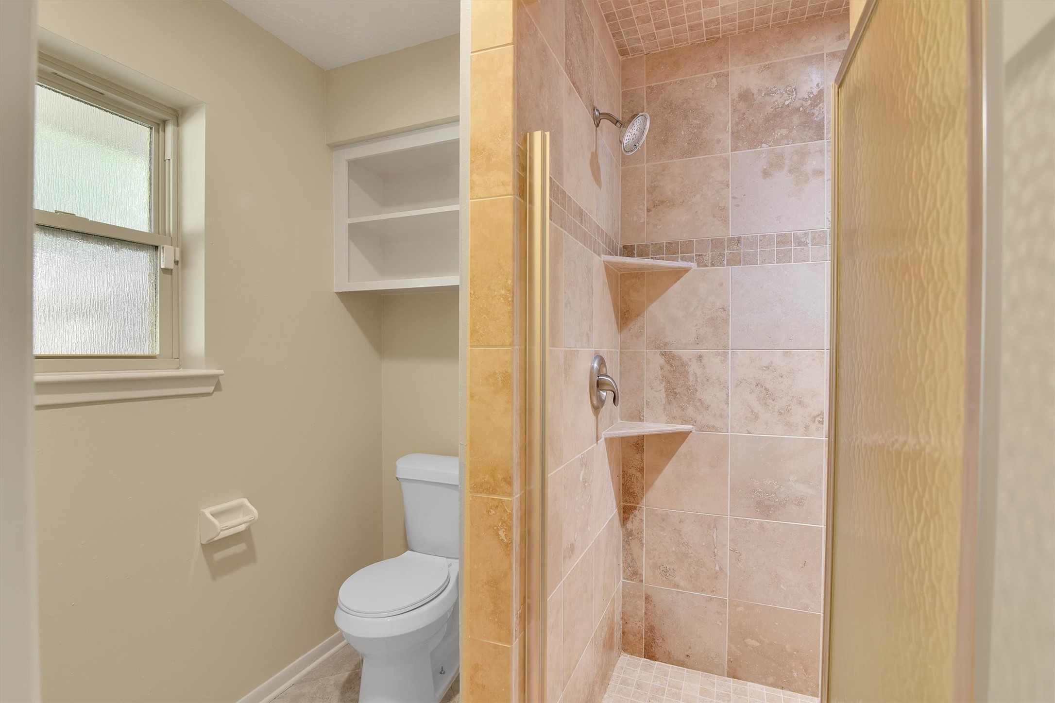 345 Maple Lane Conroe, TX 77304 - Photo 18 of 35 a bathroom with a toilet and a shower