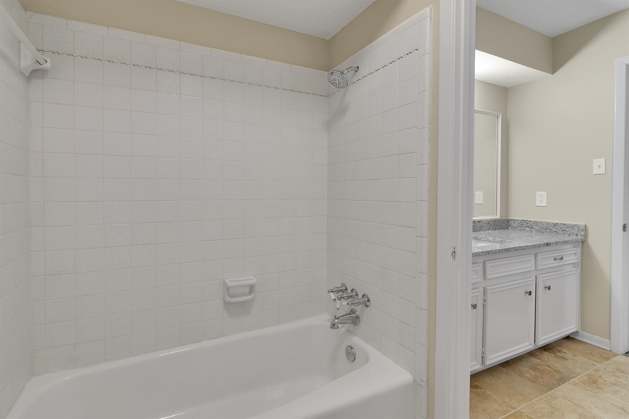 345 Maple Lane Conroe, TX 77304 - Photo 21 of 35 a bathroom with a bathtub and a sink