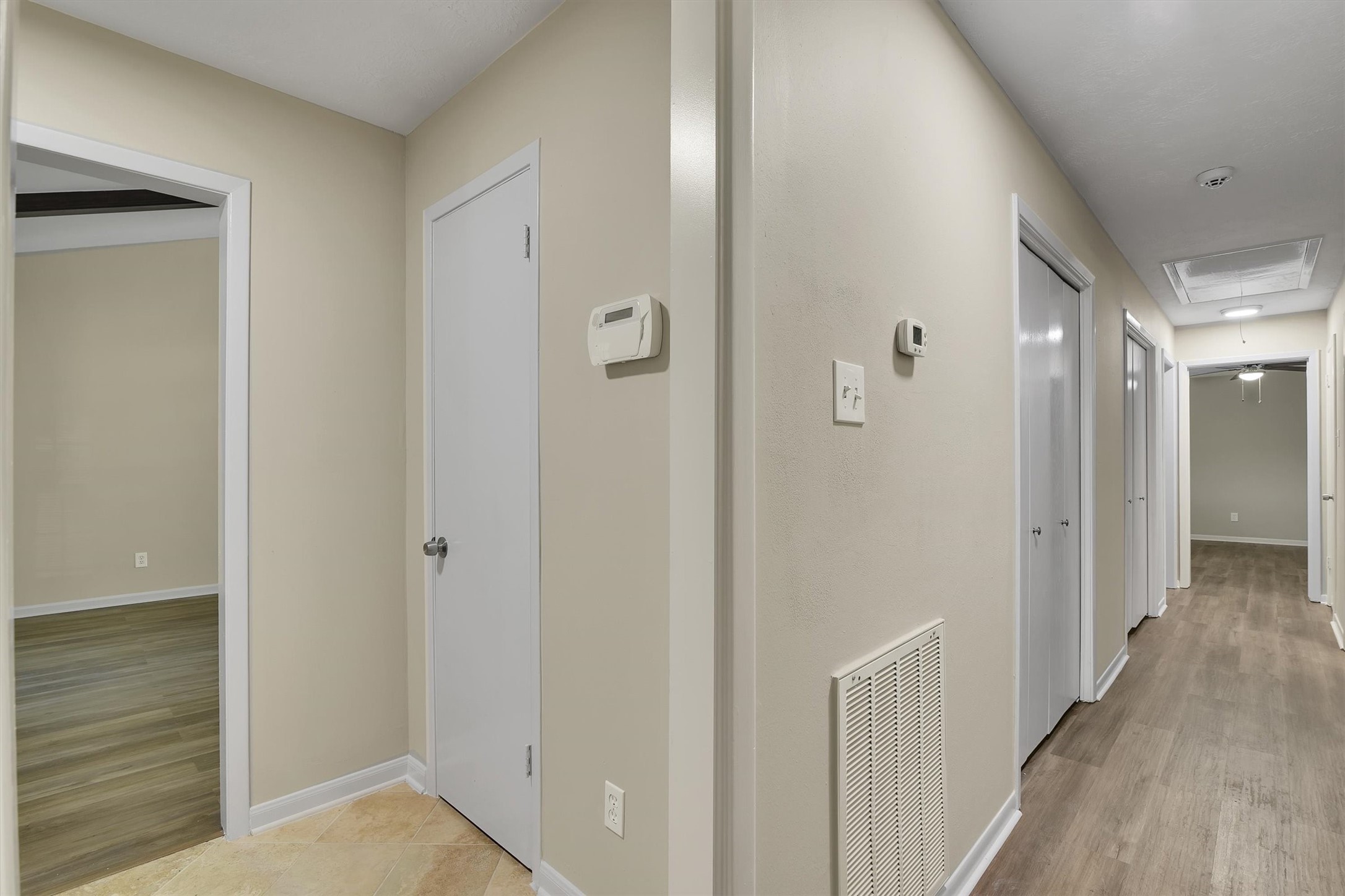345 Maple Lane Conroe, TX 77304 - Photo 24 of 35 a view of a hallway with wooden floor