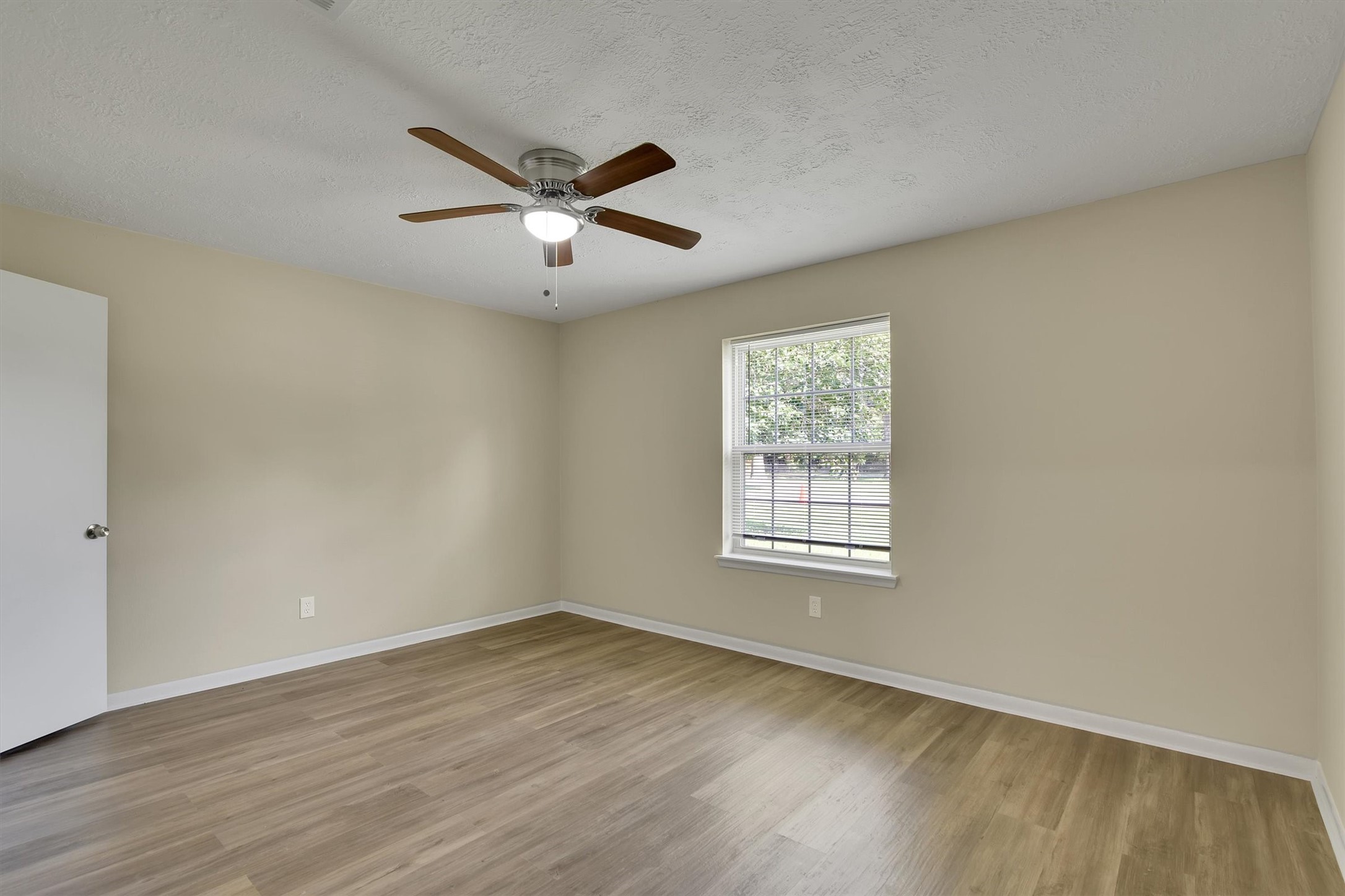 345 Maple Lane Conroe, TX 77304 - Photo 25 of 35 a view of a big room with wooden floor and windows