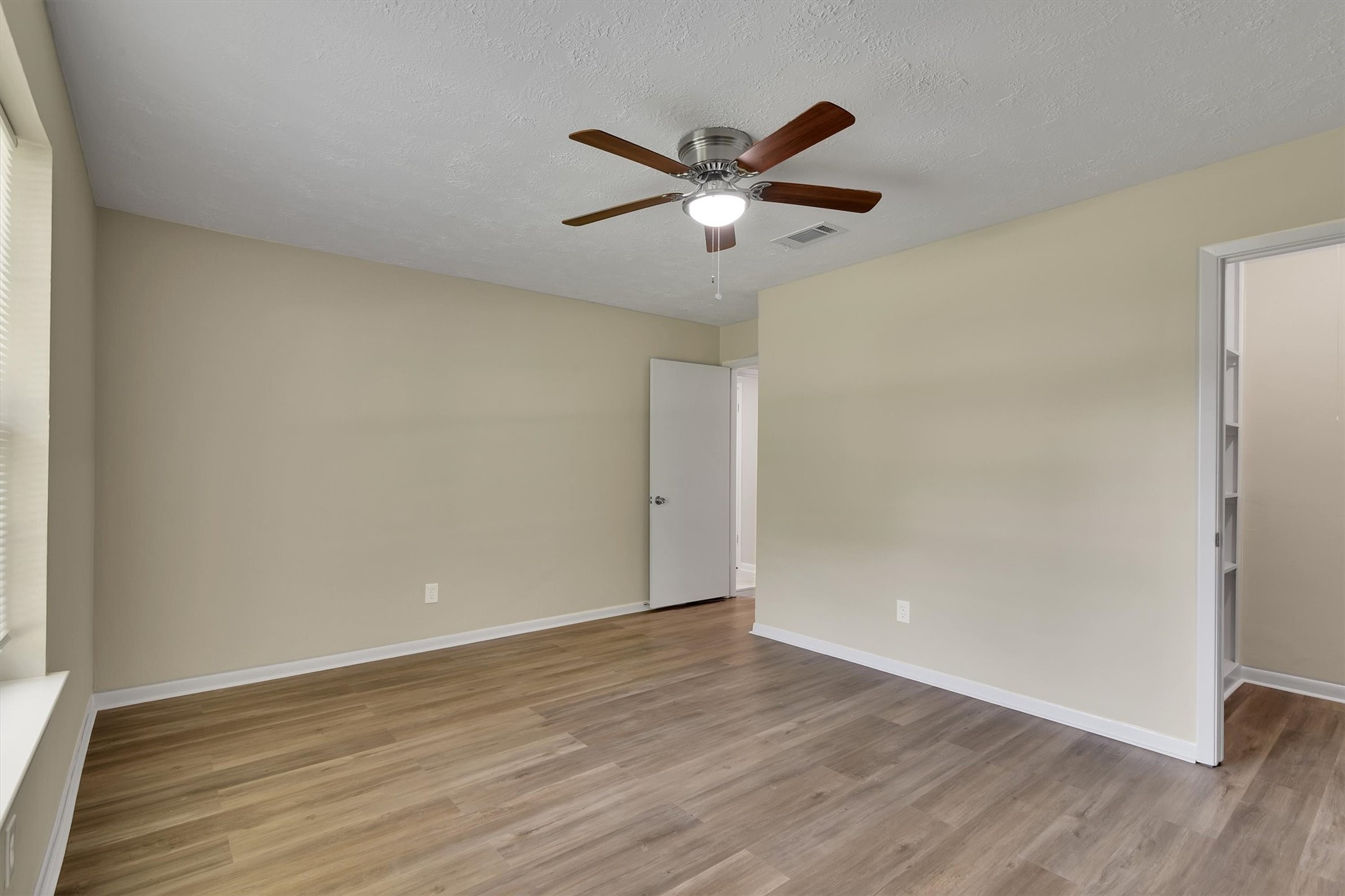 345 Maple Lane Conroe, TX 77304 - Photo 27 of 35 a view of empty room with wooden floor