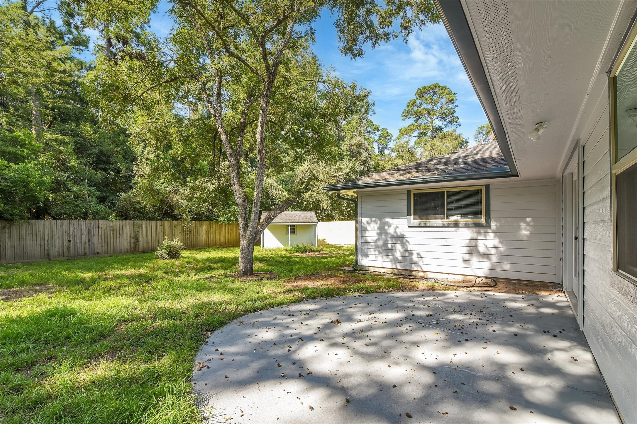 345 Maple Lane Conroe, TX 77304 - Photo 29 of 35 a front view of a house with garden