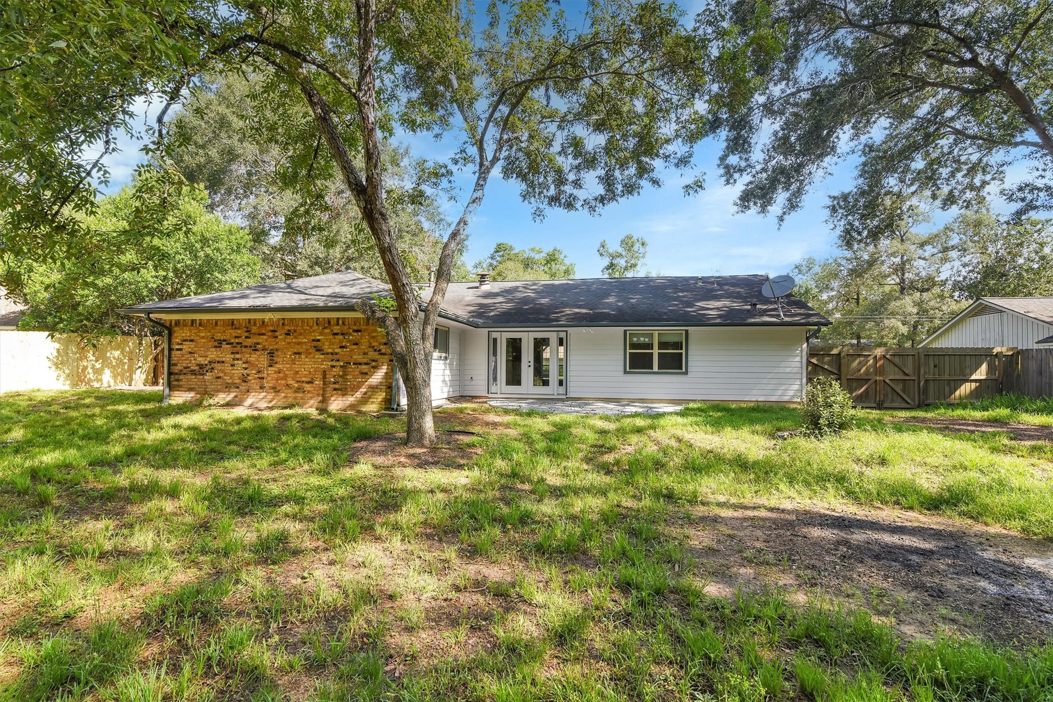 345 Maple Lane Conroe, TX 77304 - Photo 32 of 35 a front view of a house with garden