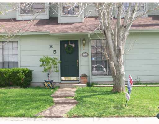 3038 Quail Springs Road, Unit B5 Corpus Christi, TX 78414 - Photo 1 of 1 a front view of a house with a yard