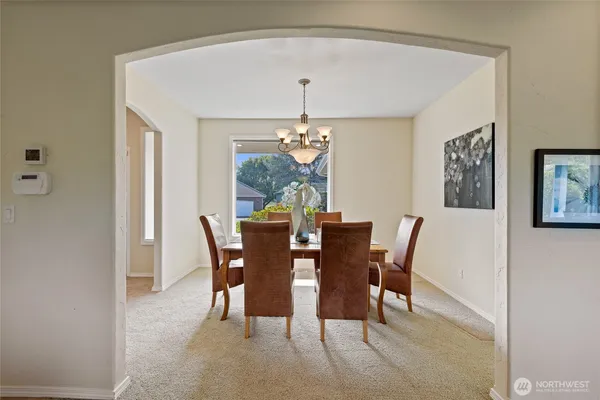 a dining room with furniture and window