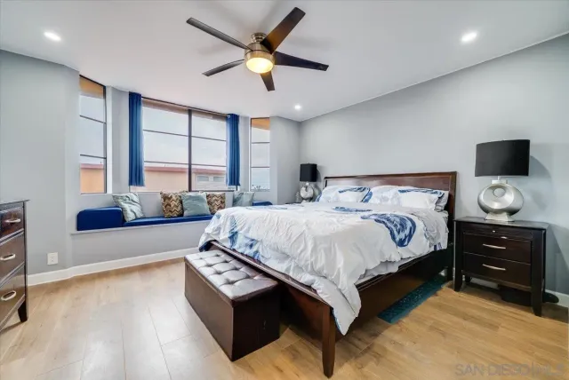 a spacious bedroom with a bed and a couch