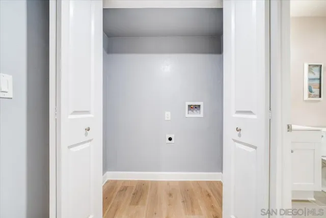 a view of workspace with wooden floor and windows