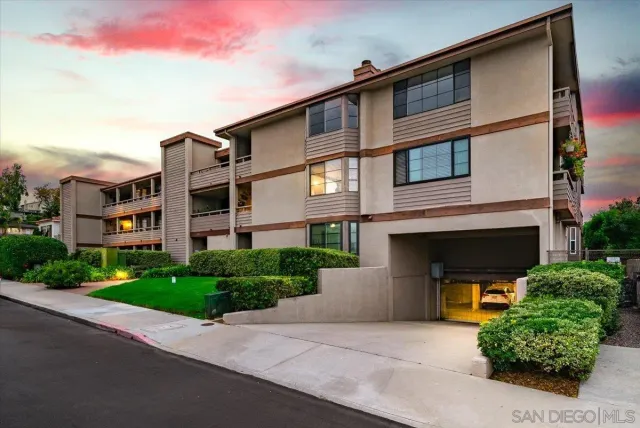 a front view of a house with a garage