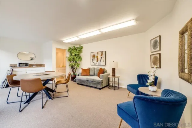 a view of a chairs and table in the backyard