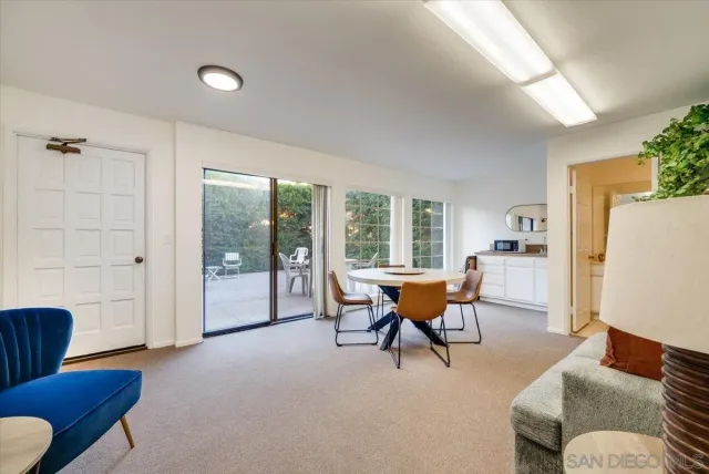 a building outdoor space with patio furniture and potted plants