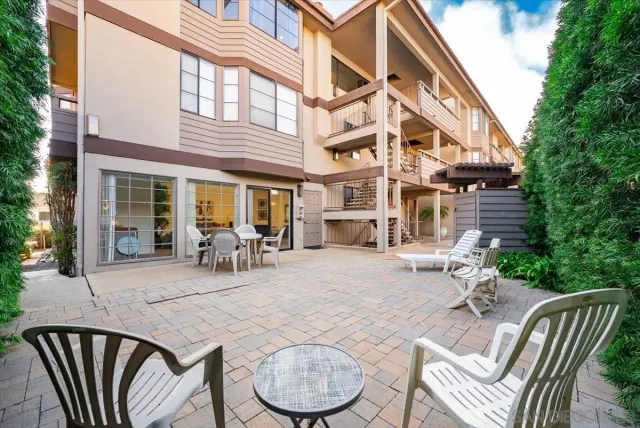 a view of an chairs and table in the patio