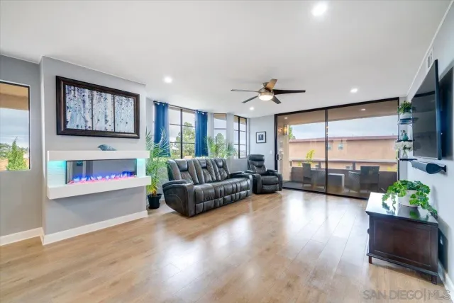 a living room with furniture fireplace and window