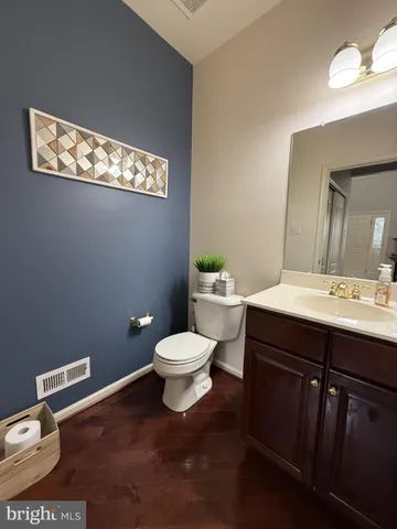 a spacious bedroom with a bed and a fireplace