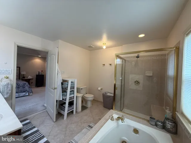 a view of workspace with mirror on the wall