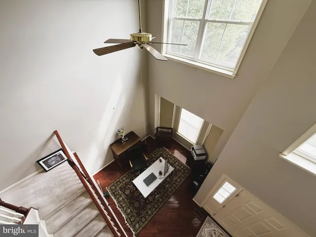 a view of an entryway with wooden floor and windows