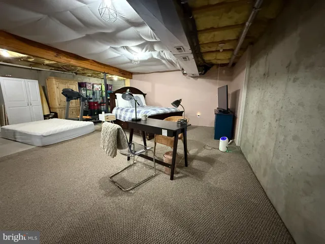 a view of a patio with couches table and chairs and wooden floor