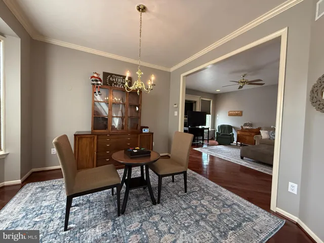 a living room with furniture rug and window