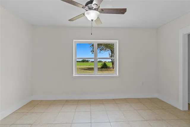 a view of an entryway and chandelier fan