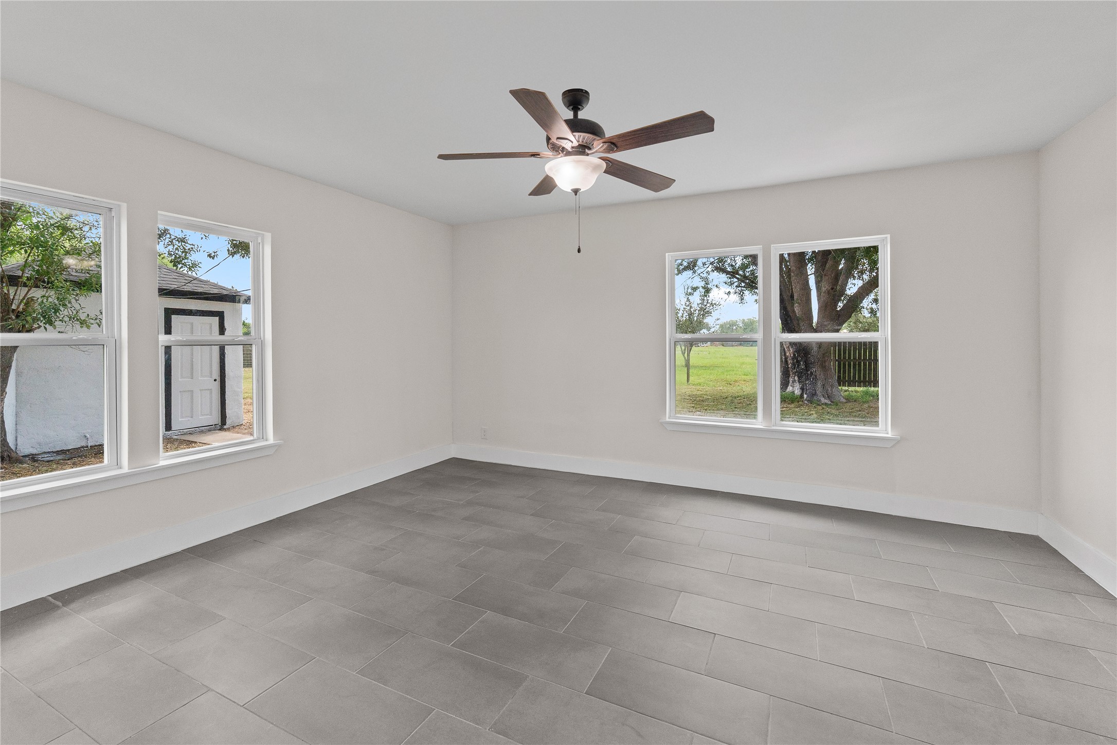 16752 Rio Rancho Road Harlingen, TX 78552 - Photo 16 of 25 a view of an empty room with a window