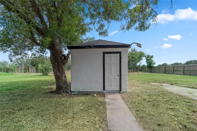 a view of backyard with green space