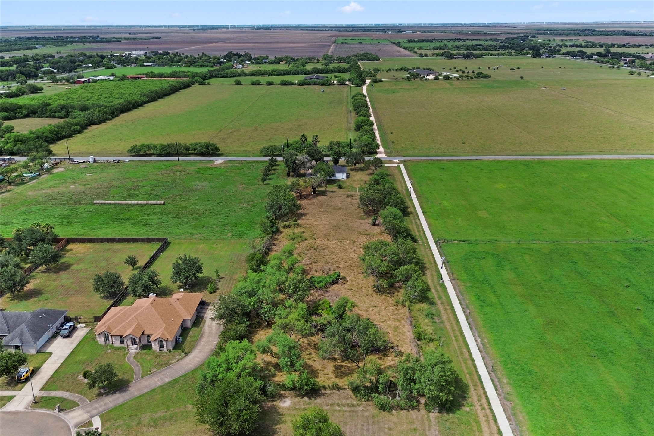 16752 Rio Rancho Road Harlingen, TX 78552 - Photo 25 of 25 an aerial view of a golf course with a lake view