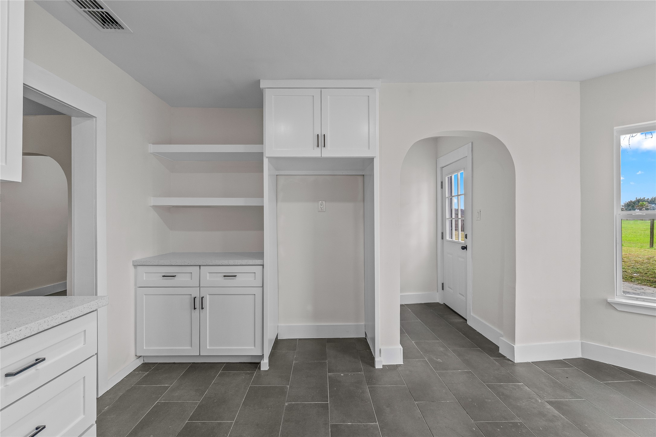 16752 Rio Rancho Road Harlingen, TX 78552 - Photo 9 of 25 a view of kitchen with cabinets and window