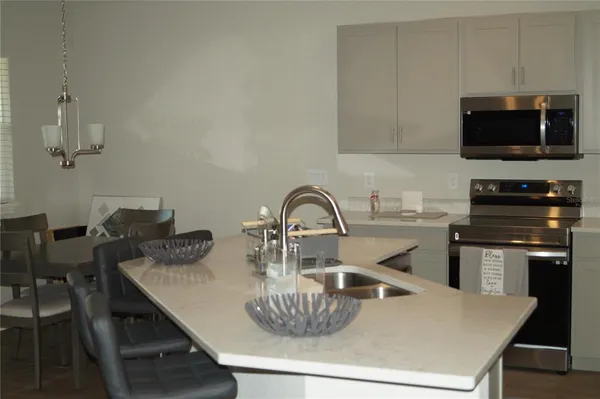 a kitchen with a table and chairs