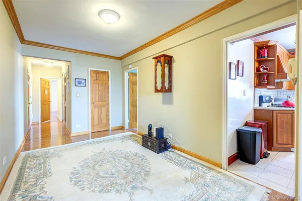 a view of a livingroom with workspace and a window