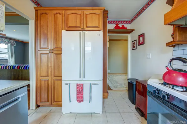 a kitchen with stainless steel appliances granite countertop a refrigerator and a stove