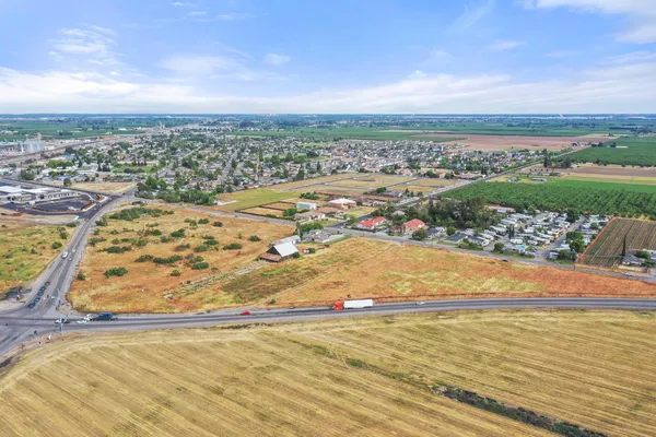 an aerial view of residential building and ocean view