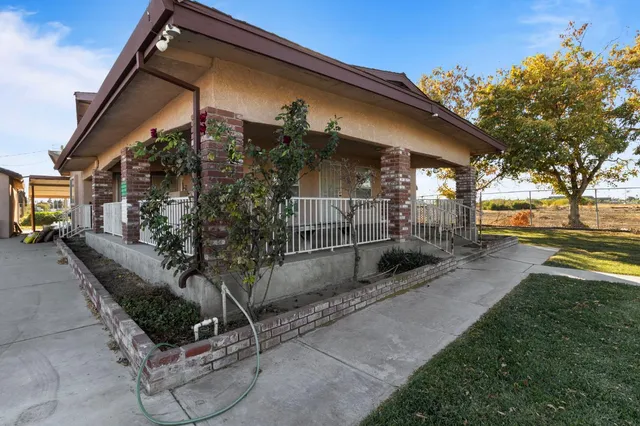 a kitchen with a stove sink and cabinets