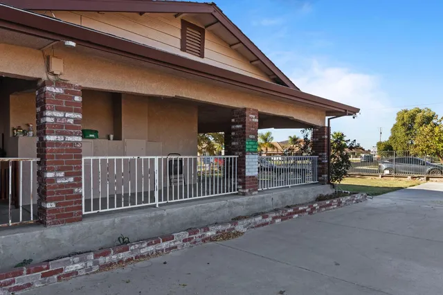 a kitchen with stainless steel appliances granite countertop a refrigerator and a stove
