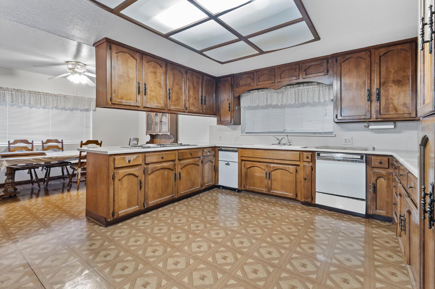 5000 Nunes Road Turlock, CA 95382 - Photo 32 of 57 a kitchen with a stove sink and cabinets