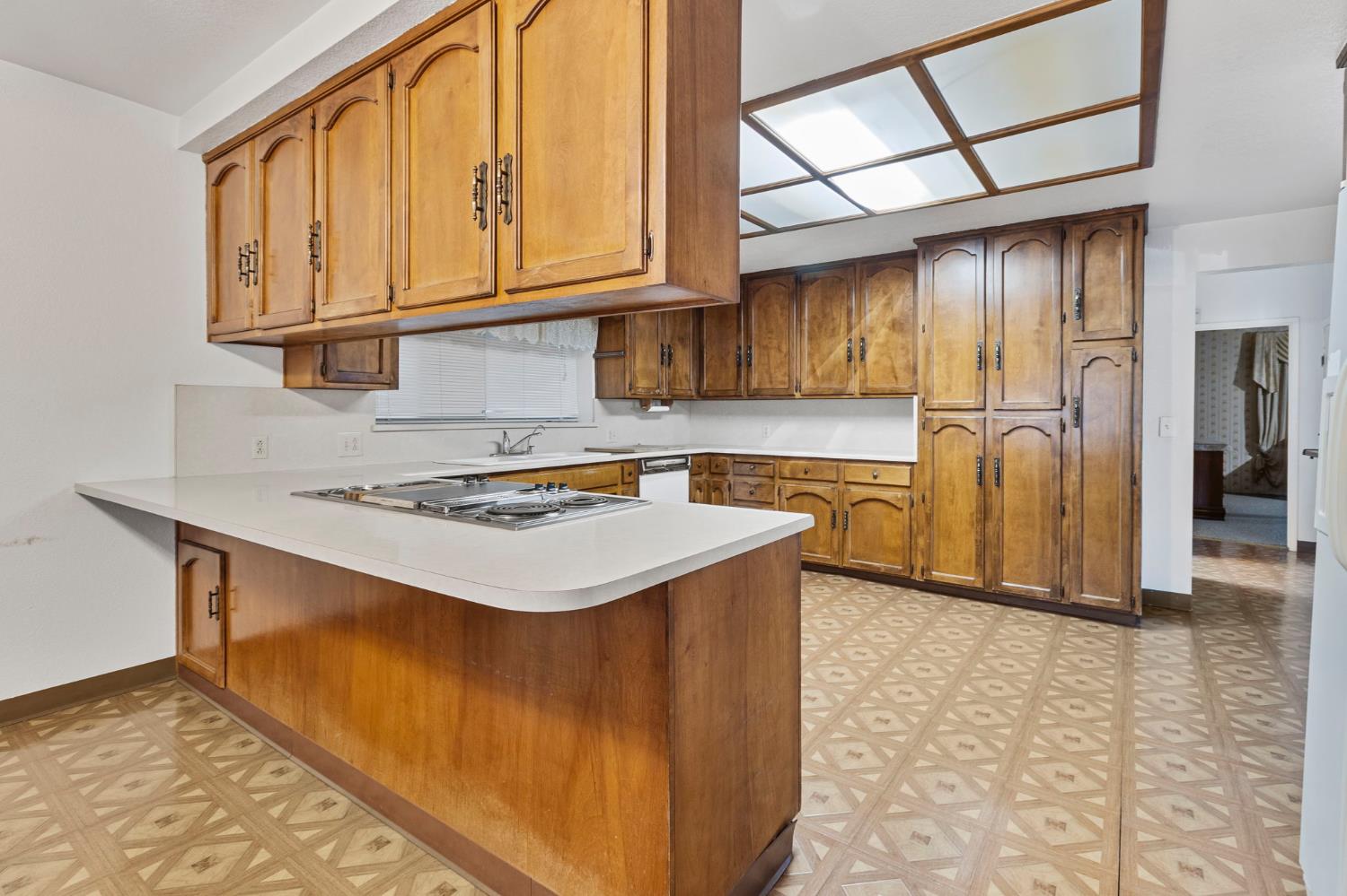 5000 Nunes Road Turlock, CA 95382 - Photo 35 of 57 a kitchen with stainless steel appliances granite countertop a stove a refrigerator and a sink