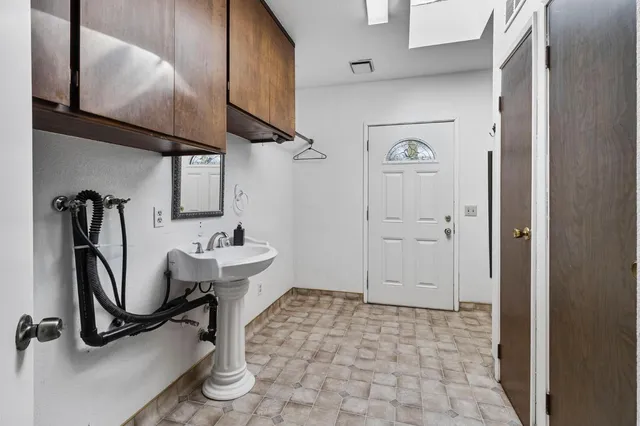 a bathroom with a sink and vanity