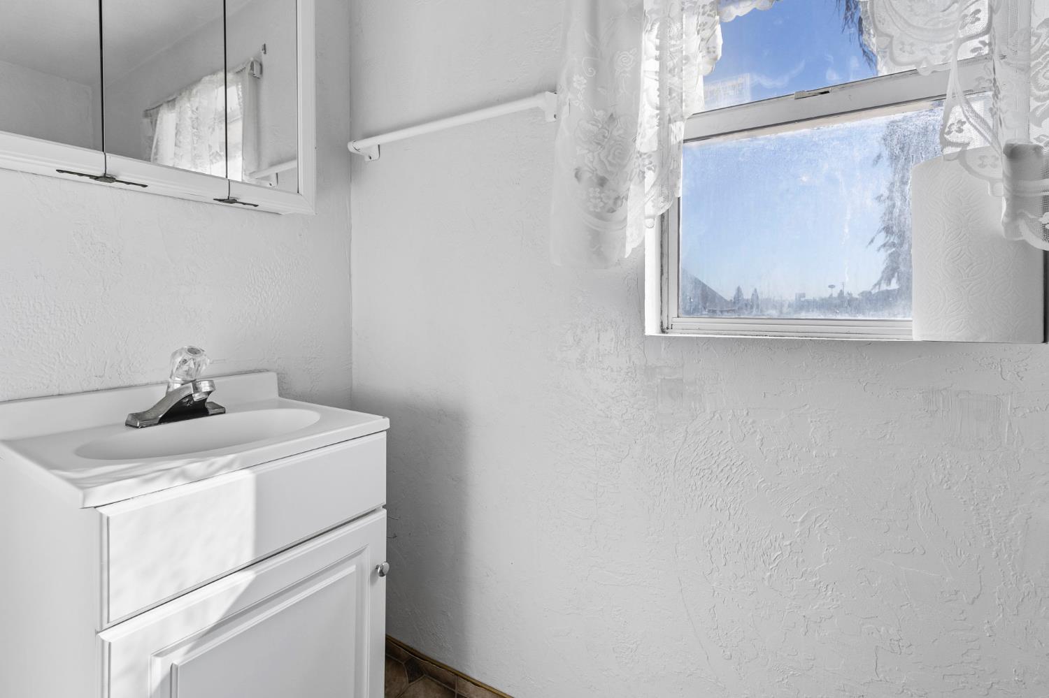 5000 Nunes Road Turlock, CA 95382 - Photo 41 of 57 a bathroom with a sink and vanity