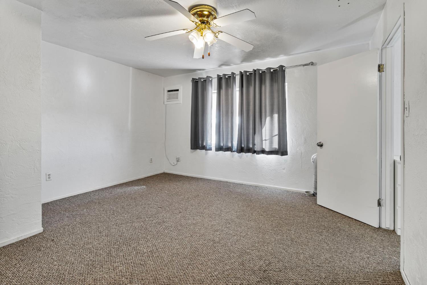 5000 Nunes Road Turlock, CA 95382 - Photo 44 of 57 a view of an empty room with a window