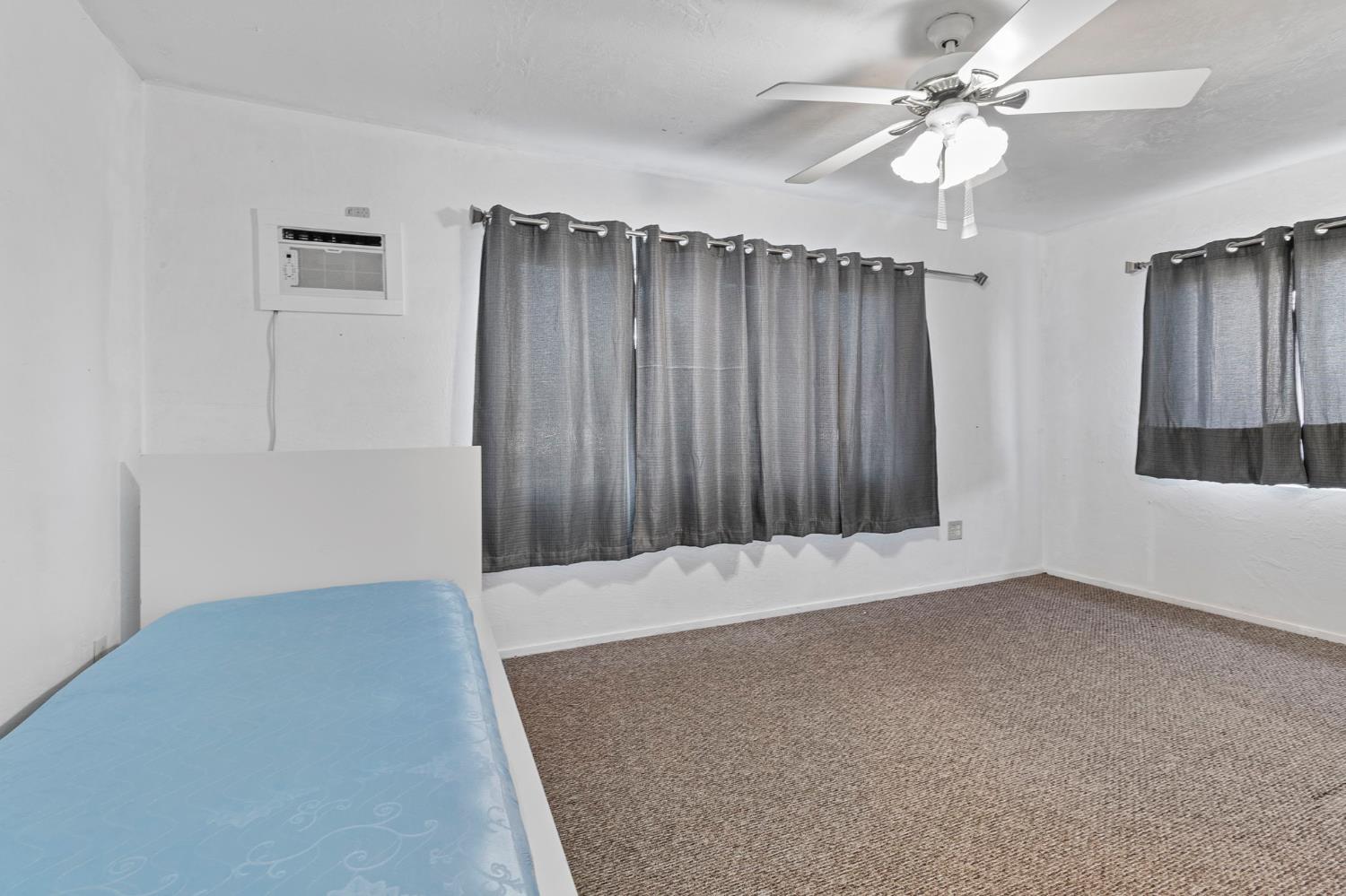 5000 Nunes Road Turlock, CA 95382 - Photo 46 of 57 an empty room with fan and windows