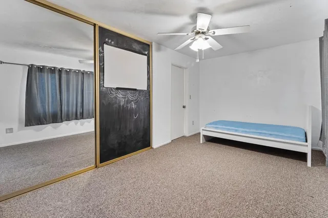 a view of a bathroom from a hallway