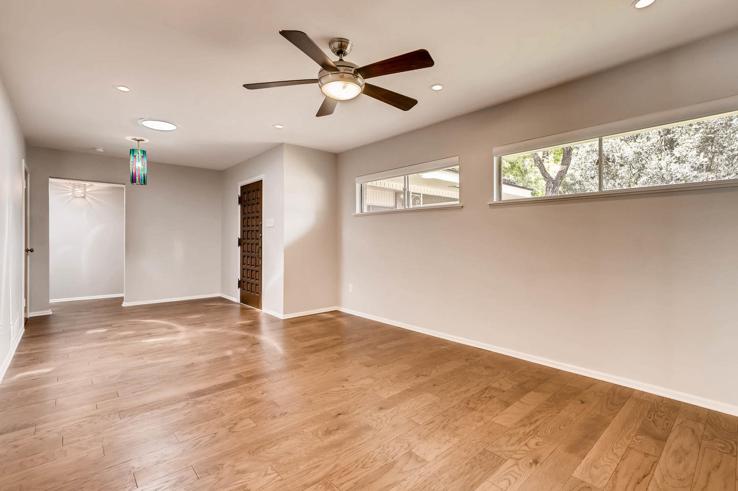 446 Pike Road San Antonio, TX 78209 - Photo 3 of 28 Hardwood floors and generous natural light create an inviting atmosphere in this open living space.