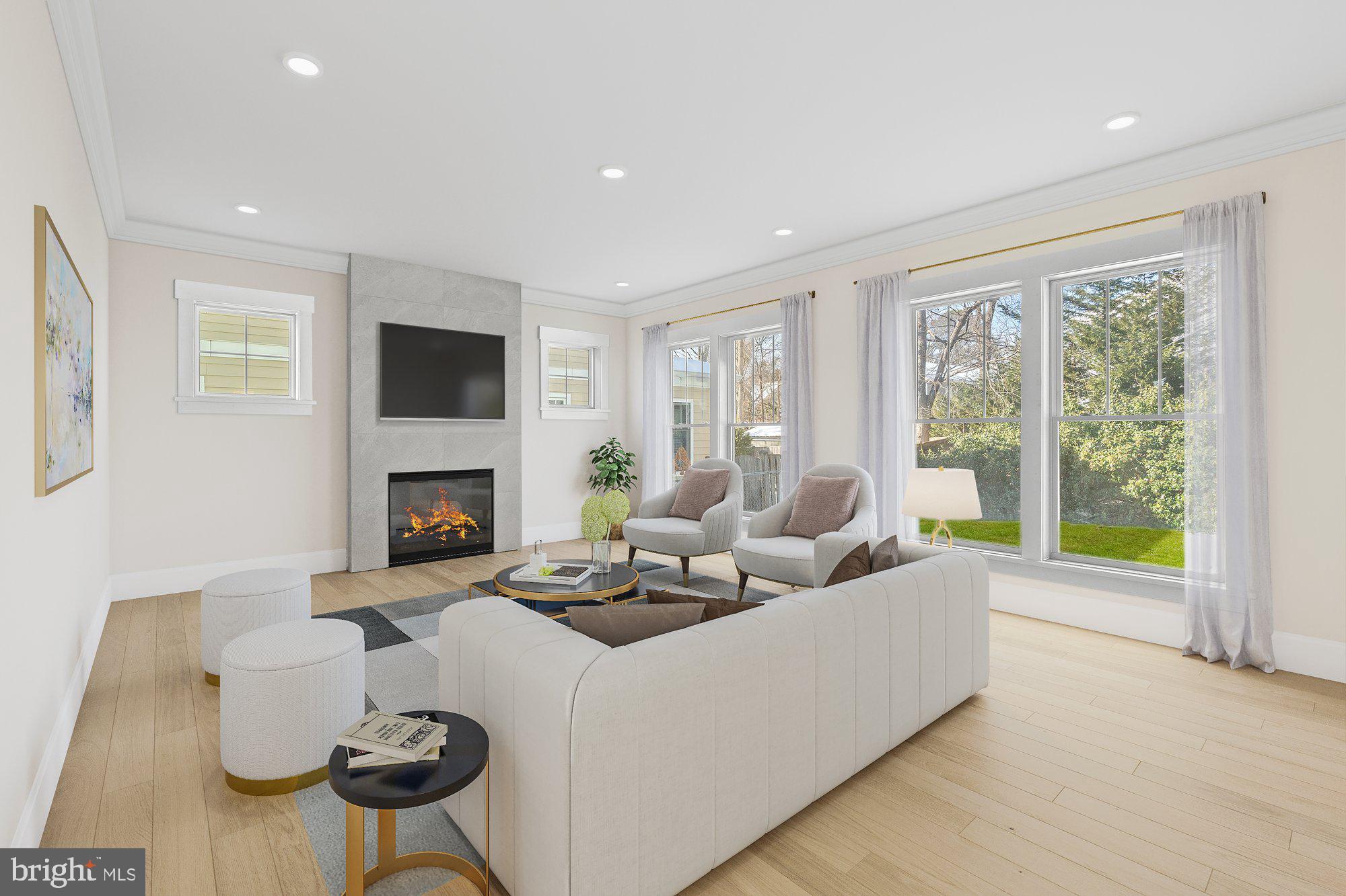 5829 25th Road North Arlington, VA 22207 - Photo 8 of 20 a living room with furniture a flat screen tv and a fireplace