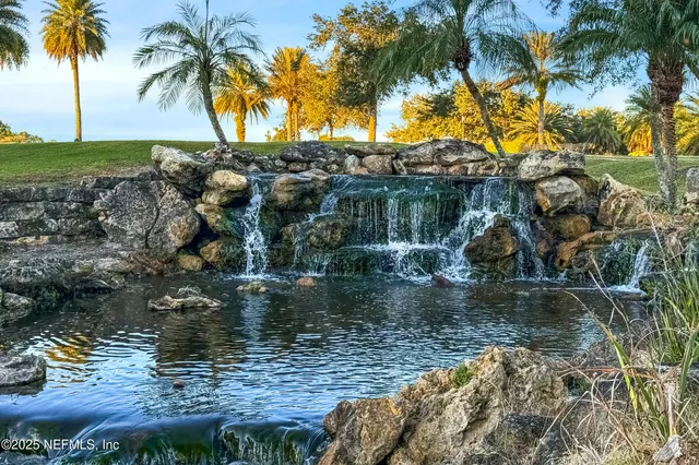 an aerial view of a house with a lake view