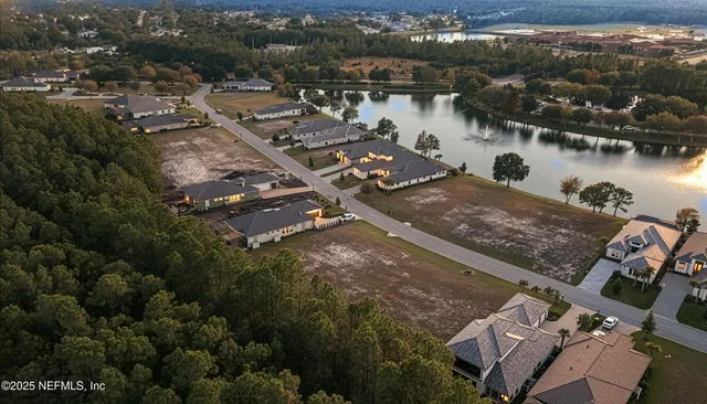 a view of a park with couches swimming pool and outdoor seating