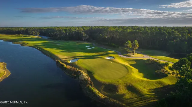 a view of a swimming pool with an outdoor seating
