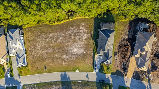 front view of a brick house with a yard