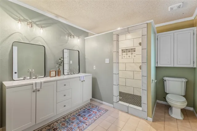 a bathroom with a toilet sink and shower