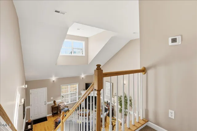 an empty room with closet and a ceiling fan