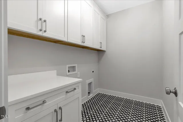 a view of a storage and utility room with closet