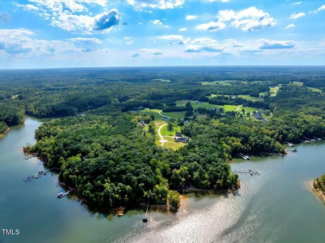 an aerial view of a houses with ocean view